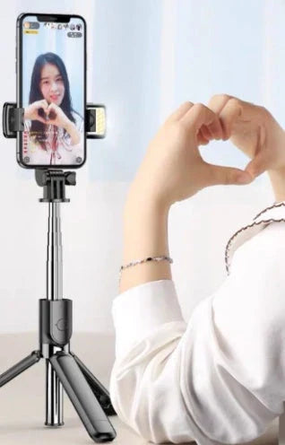Adjustable Bluetooth selfie stick with remote control and tripod for iPhone, ideal for capturing full-body and hands-free mobile photos