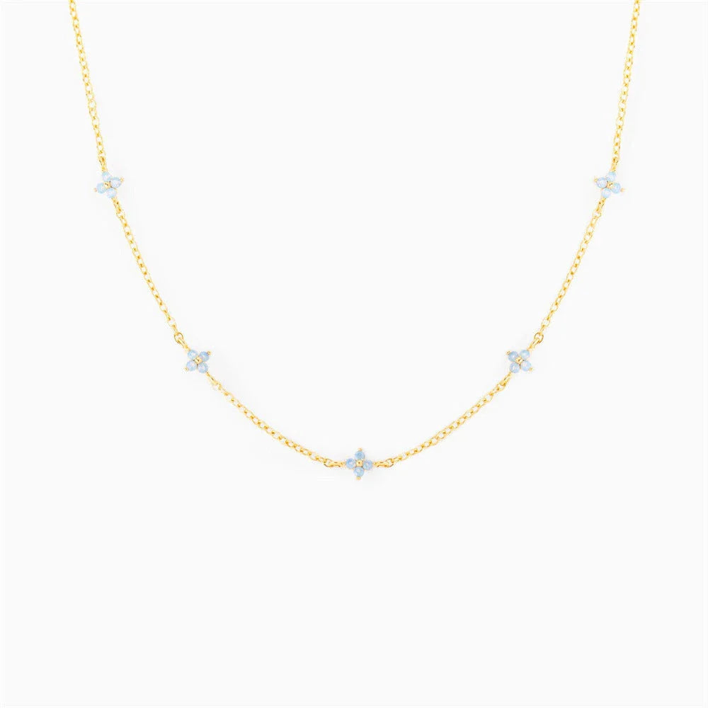 Elegant floral statement necklace in various color options, including golden blue, silver blue, golden green, and silver green, with an adjustable chain and high-quality construction.