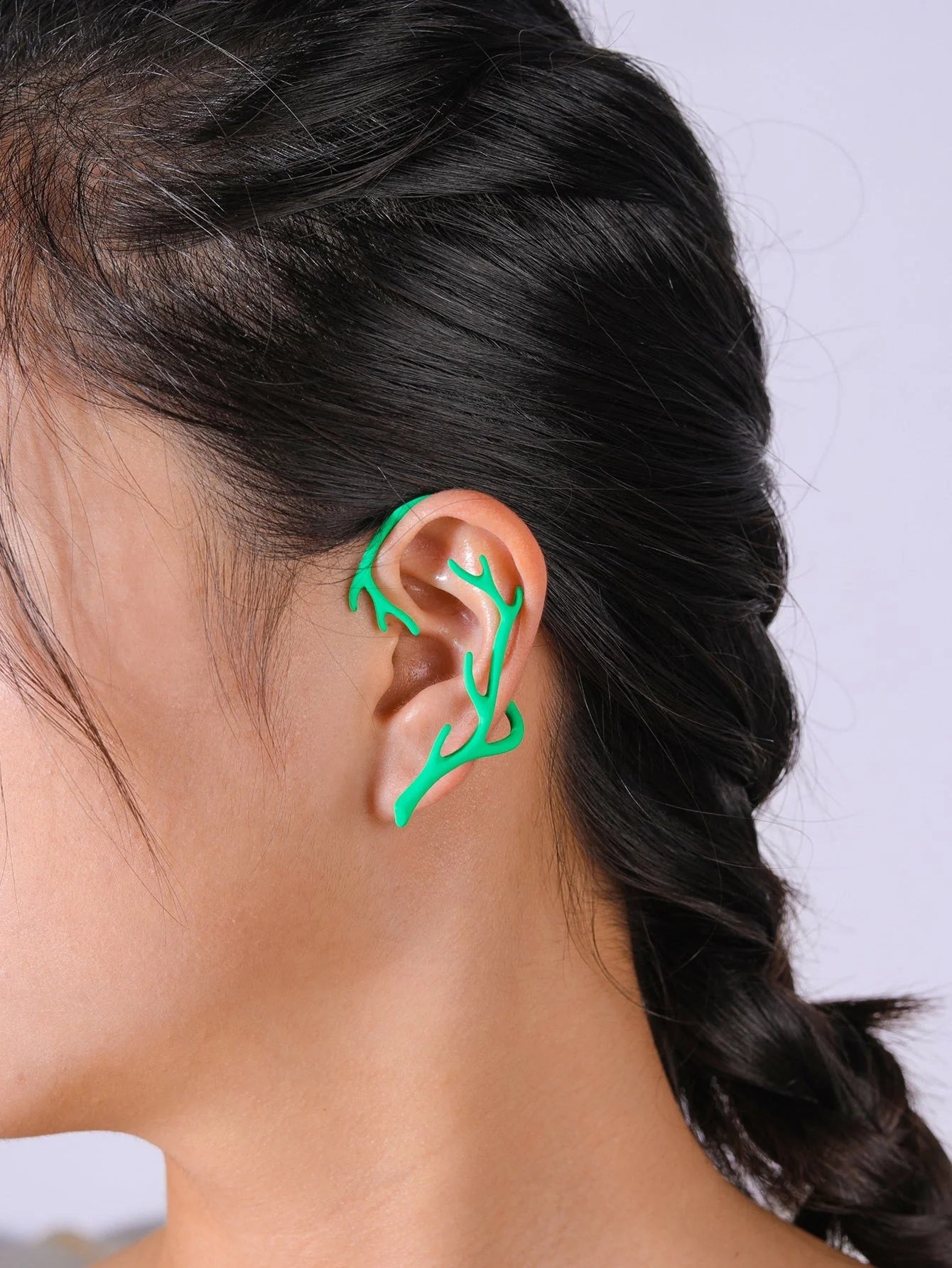Vintage bone hypoallergenic elf earrings with geometric design in gold, silver, black, and green