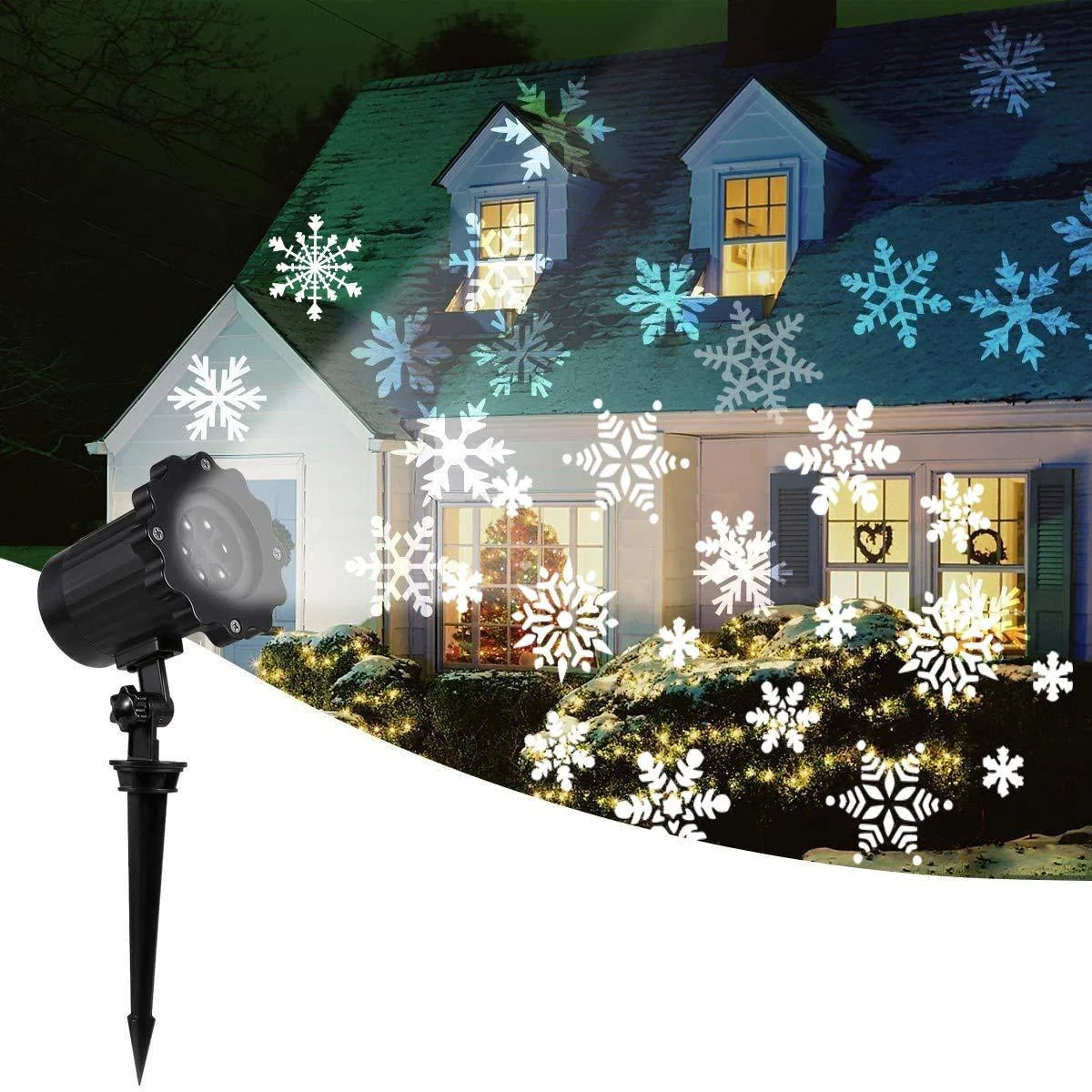 LED Christmas Blizzard Snowflake Laser Light Projector illuminating a garden with white snowflake patterns
