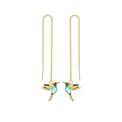 Elegant hummingbird drop earrings with crystal accents, a versatile fashion accessory for British women