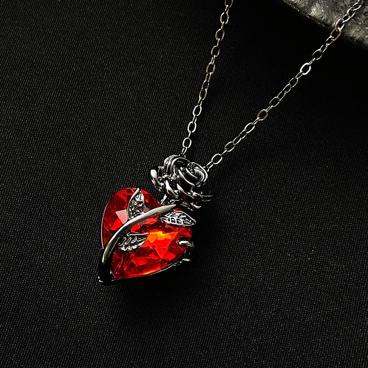 Punk Rose Love Necklace with heart-shaped clavicle chain pendant in black, gold, and silver.