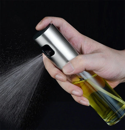 Stainless steel kitchen oil spray bottle with ergonomic button and glass body