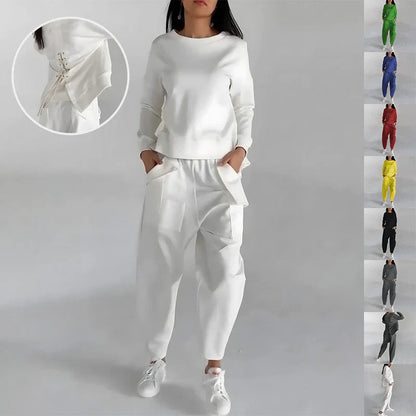 Stylish polyester sweatshirt with back slit, pockets, and available in various colors