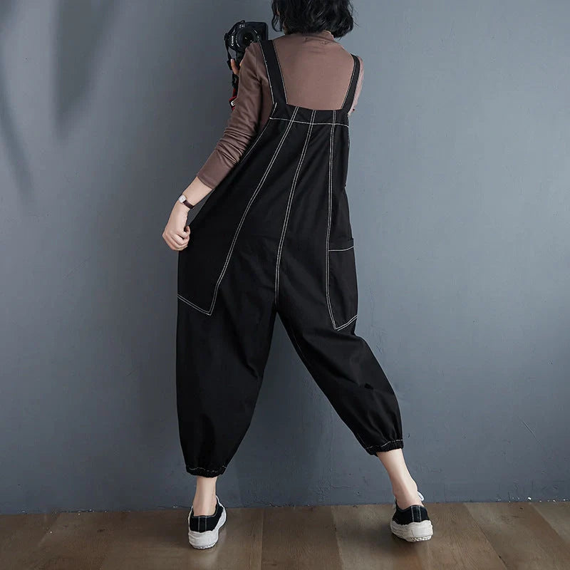 Stylish plus-size black and yellow dungarees in a comfortable, fashionable design for the modern commuter