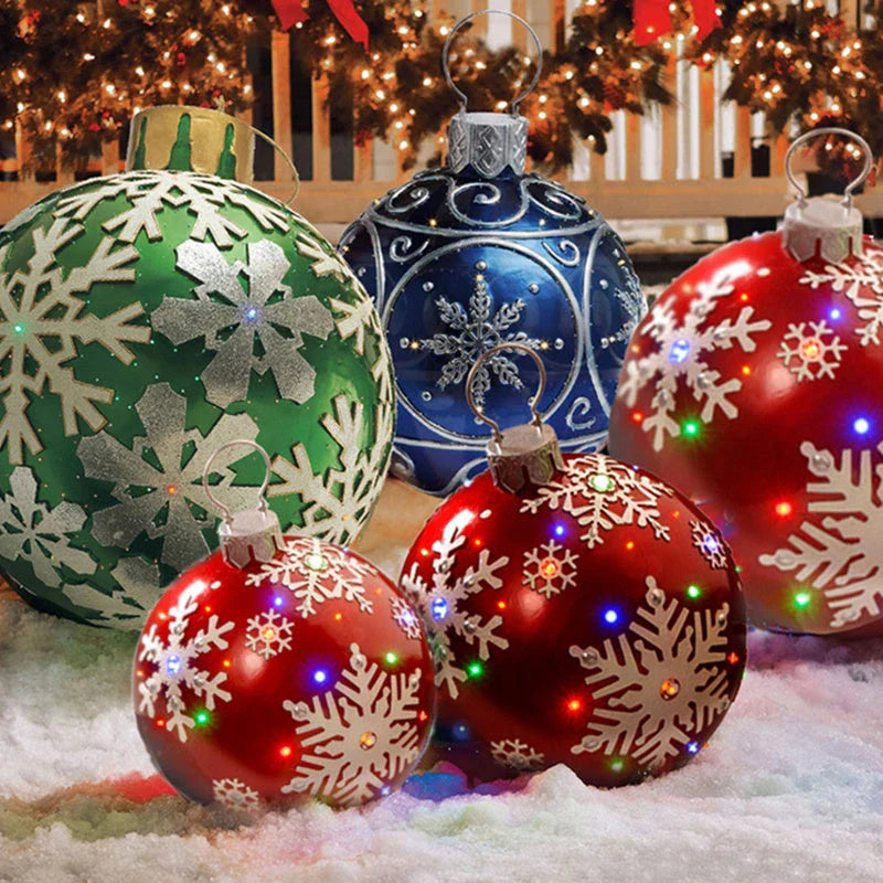 Inflatable Christmas baubles in various festive designs for outdoor holiday decoration
