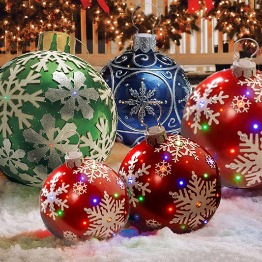 Inflatable Christmas baubles in various festive designs for outdoor holiday decoration