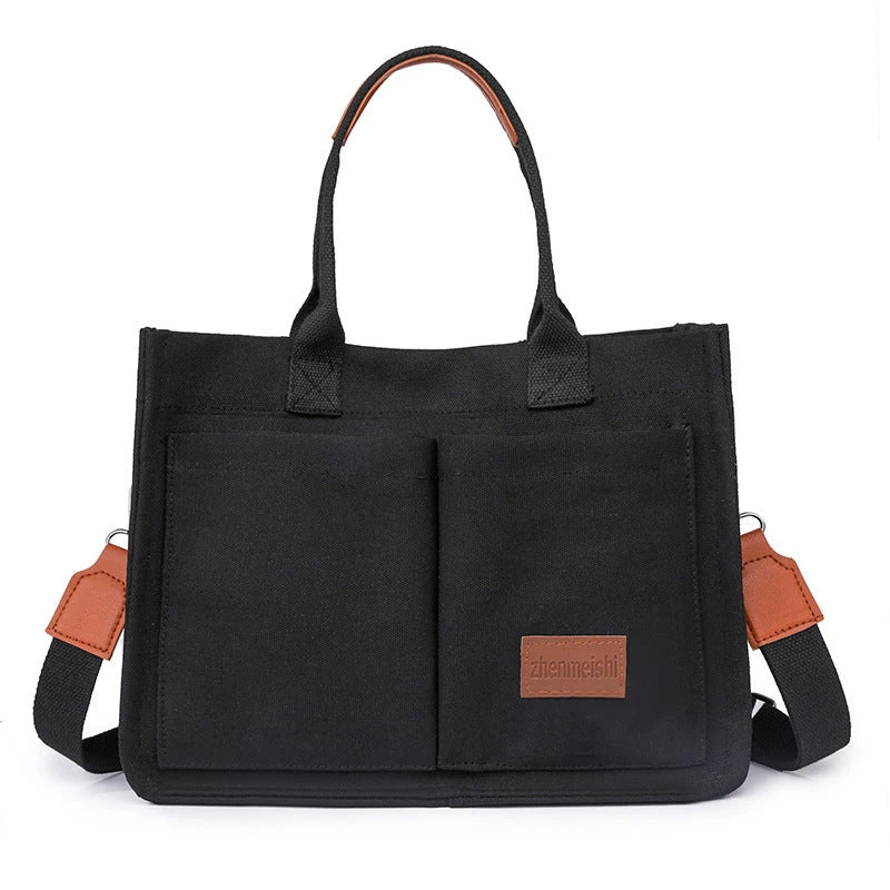 Stylish and durable canvas tote bag with multiple pockets for everyday use