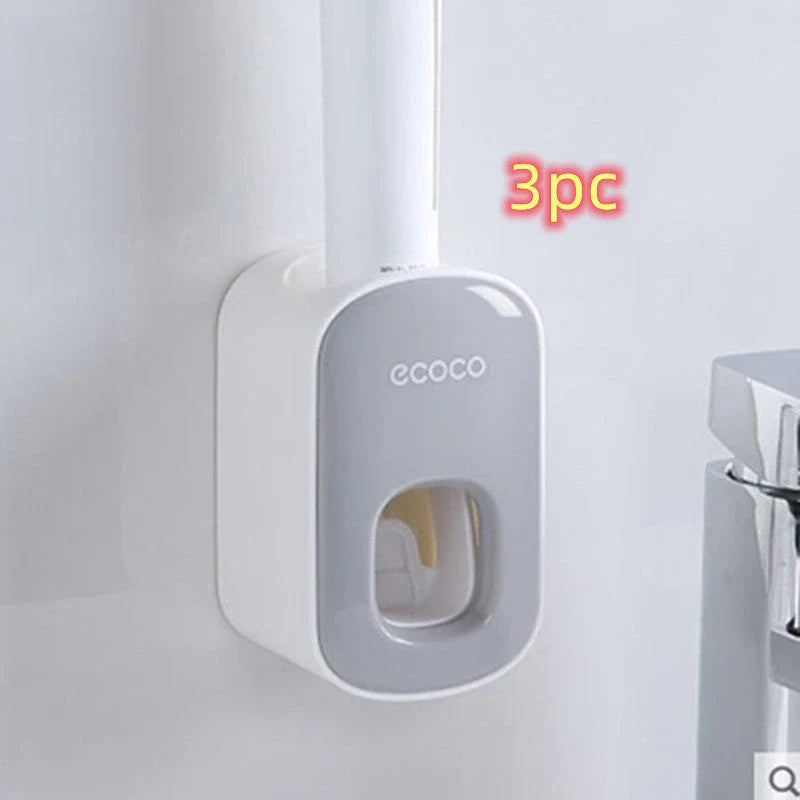 Wall-mounted automatic toothpaste dispenser with storage cups for toothbrush and bathroom accessories