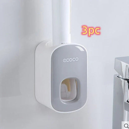Wall-mounted automatic toothpaste dispenser with storage cups for toothbrush and bathroom accessories