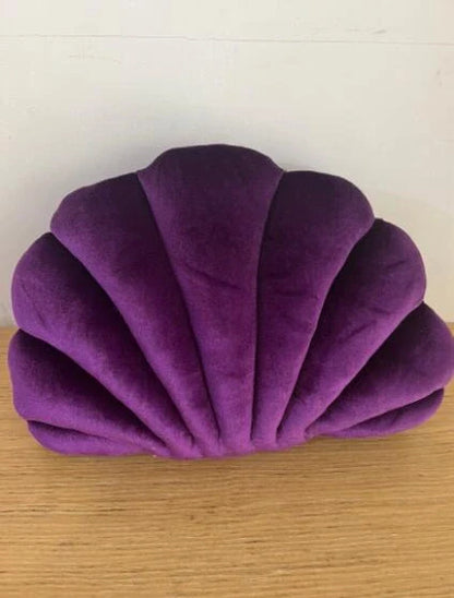 Cosy shell-shaped plush nap pillow in various colours and sizes for ultimate comfort