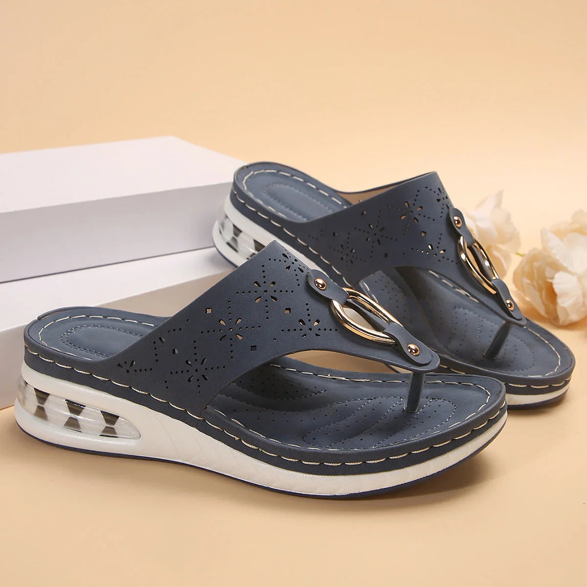 Cushioned thong sandals in various colors and sizes, featuring a unique design, air-cushioned footbed, and durable rubber sole for comfort and style.