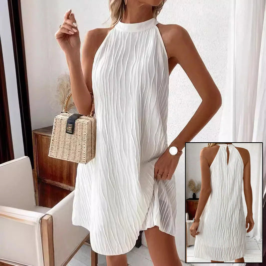 Elegant white backless halter dress with a flattering silhouette and mid-length hemline