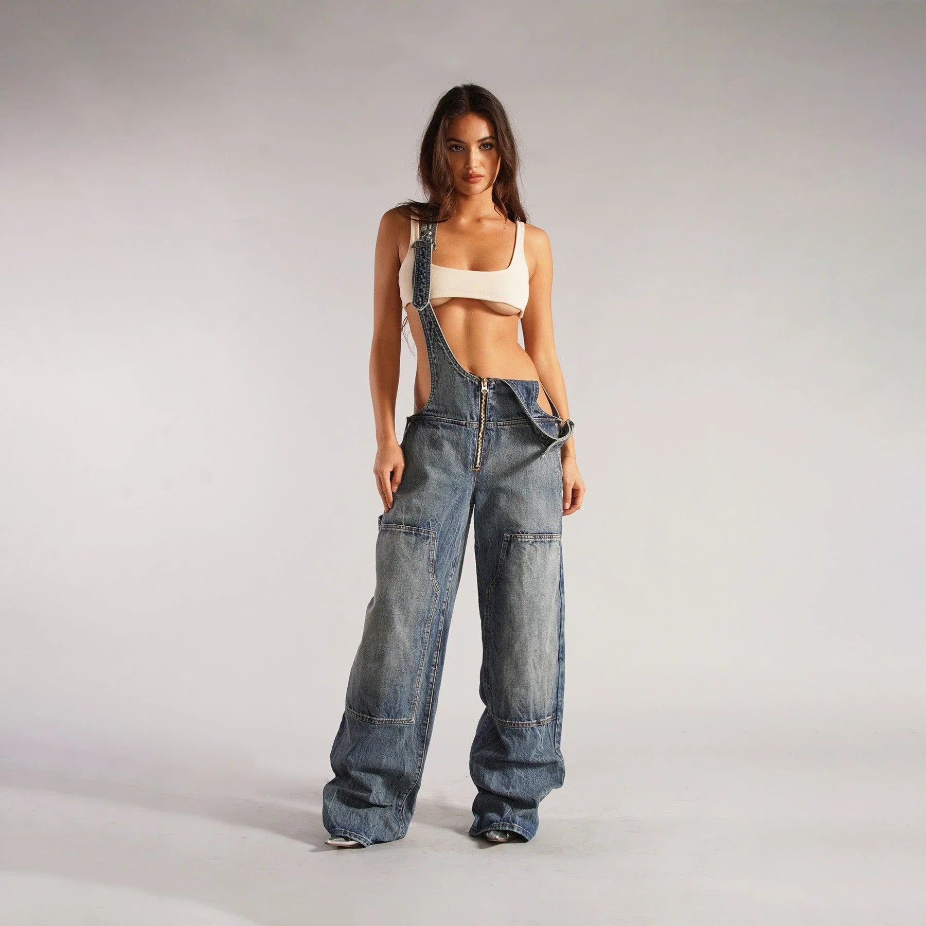 Stylish denim overalls with adjustable suspender straps, front and back pockets, and a comfortable micro-elastic fit, available in a variety of chic colors.