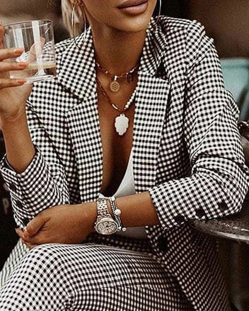 Stylish plaid suit set for modern women, featuring a tailored blazer and complementary pants in black and white or blue color options.
