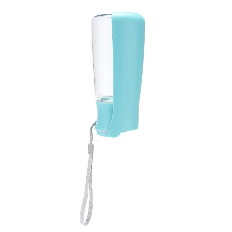 Foldable dog water bottle in blue, white, and pink, perfect for outdoor adventures with your pet.
