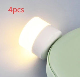 Compact USB LED night light with soft glow for reading and sleep