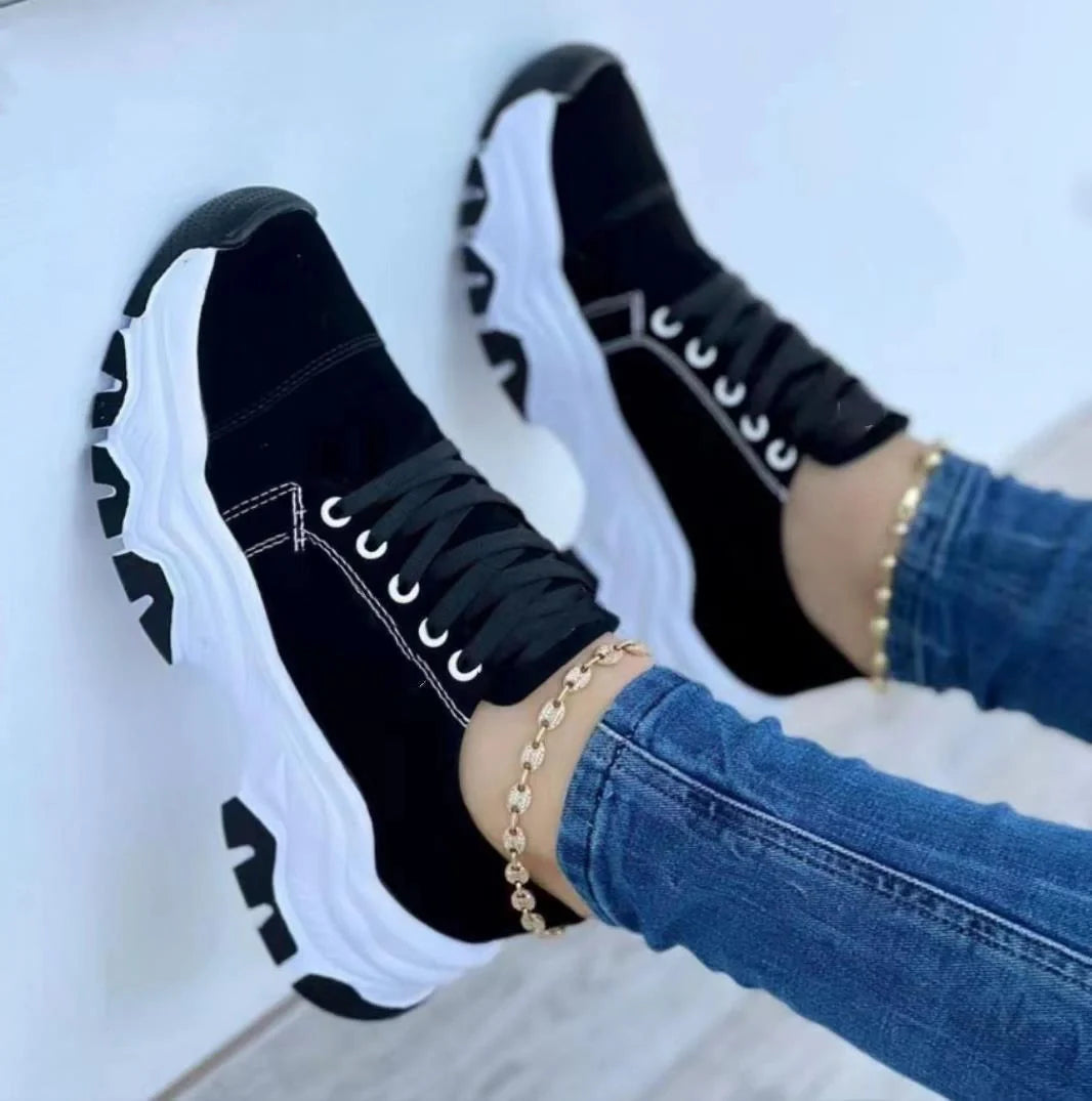 Women's platform sport flats in black, red, blue, and pink with lace-up design