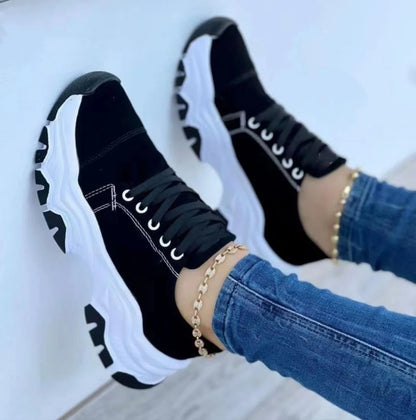 Women's platform sport flats in black, red, blue, and pink with lace-up design