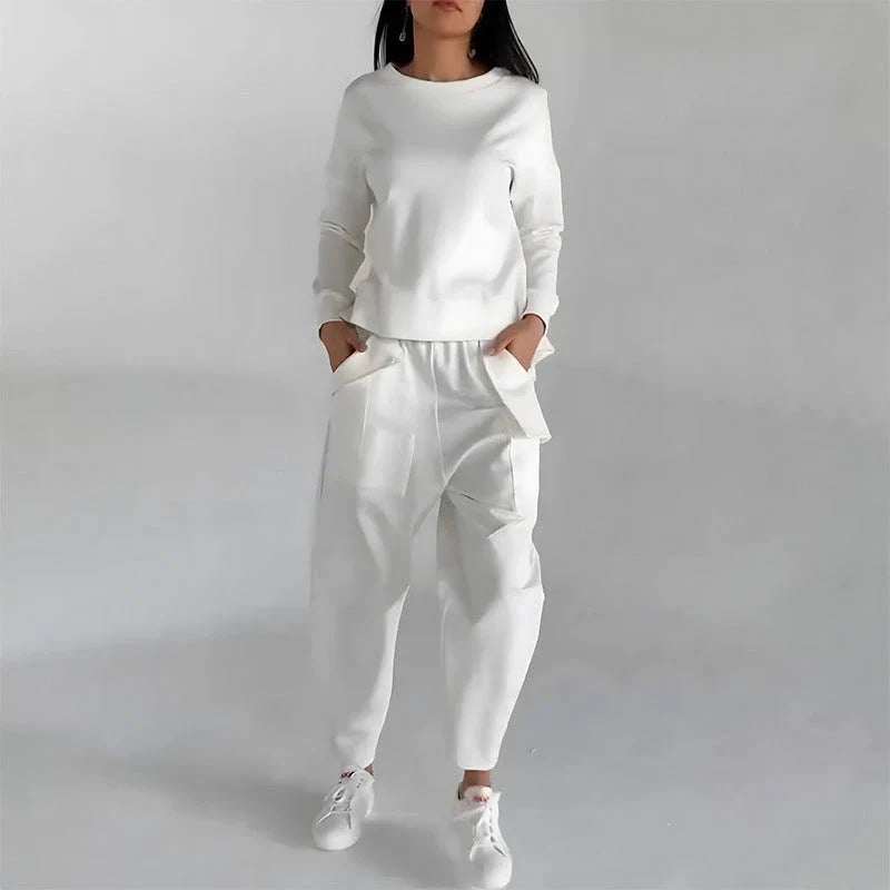 Stylish polyester sweatshirt with back slit, pockets, and available in various colors
