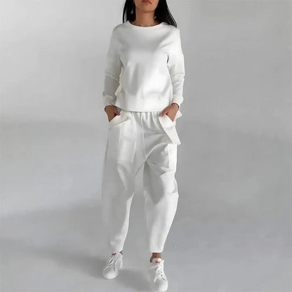 Stylish polyester sweatshirt with back slit, pockets, and available in various colors