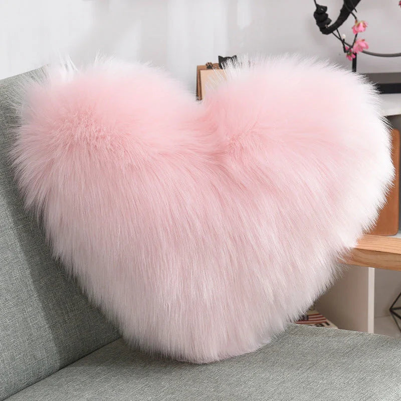 Cozy heart-shaped throw pillow with plush, shaggy texture in various colors