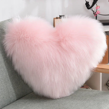 Cozy heart-shaped throw pillow with plush, shaggy texture in various colors