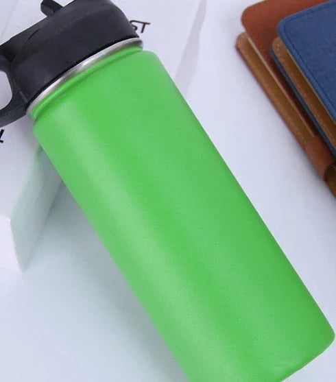 Premium stainless steel insulated tumbler with push-button lid and sleek design for outdoor adventures and active lifestyles.