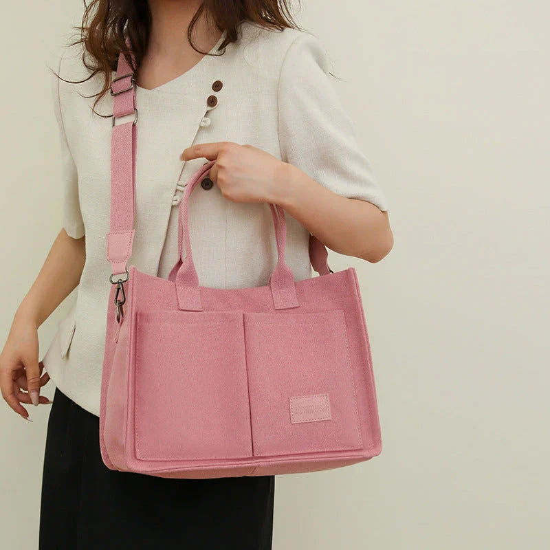 Stylish and durable canvas tote bag with multiple pockets for everyday use