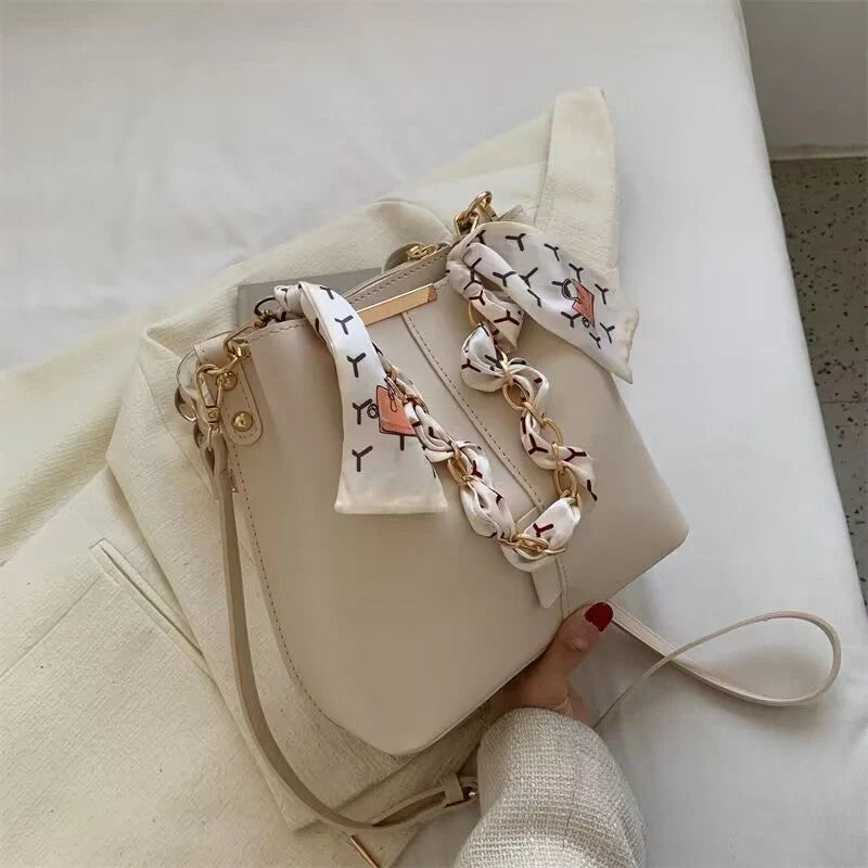 Women's PU bucket bag in white, army green, and light brown with adjustable shoulder strap