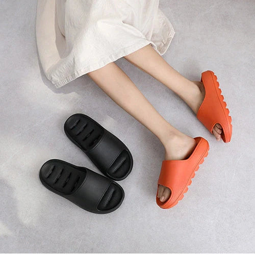 Thick-soled EVA slippers in various colours with non-slip sole and water leakage design