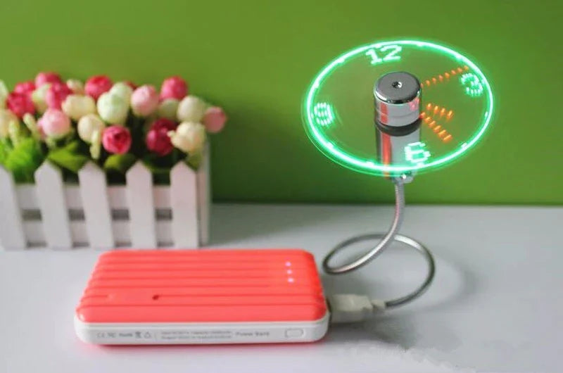 Adjustable USB desktop fan with LED light and digital clock, providing customizable airflow and workspace convenience