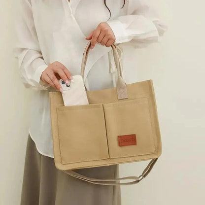 Stylish and durable canvas tote bag with multiple pockets for everyday use