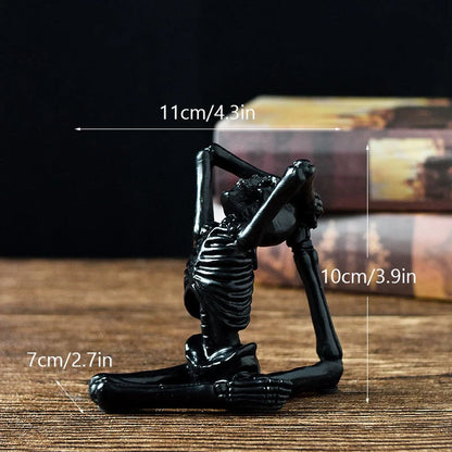 Haunting Halloween desktop ornaments, featuring intricate resin skulls and skeletons in black and vintage white finishes