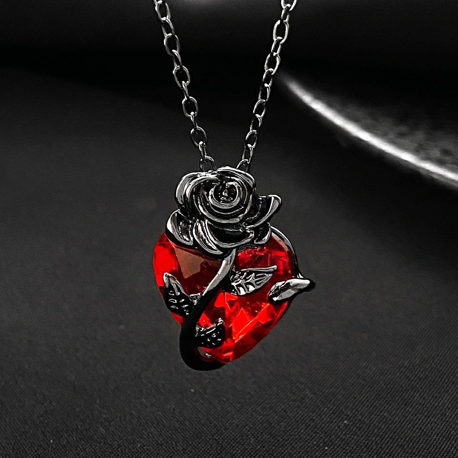 Punk Rose Love Necklace with heart-shaped clavicle chain pendant in black, gold, and silver.