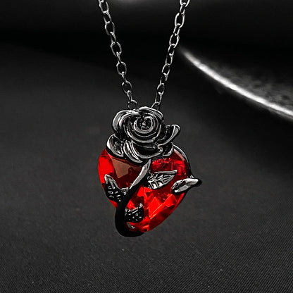 Punk Rose Love Necklace with heart-shaped clavicle chain pendant in black, gold, and silver.