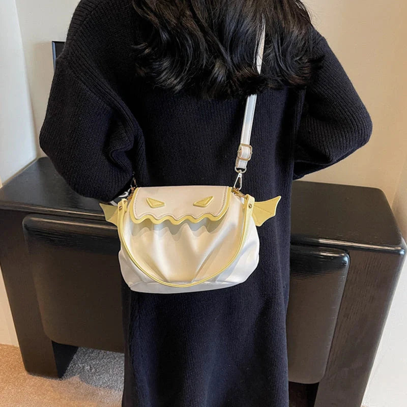 Halloween pumpkin cartoon crossbody bag with small wings in black, beige, or orange