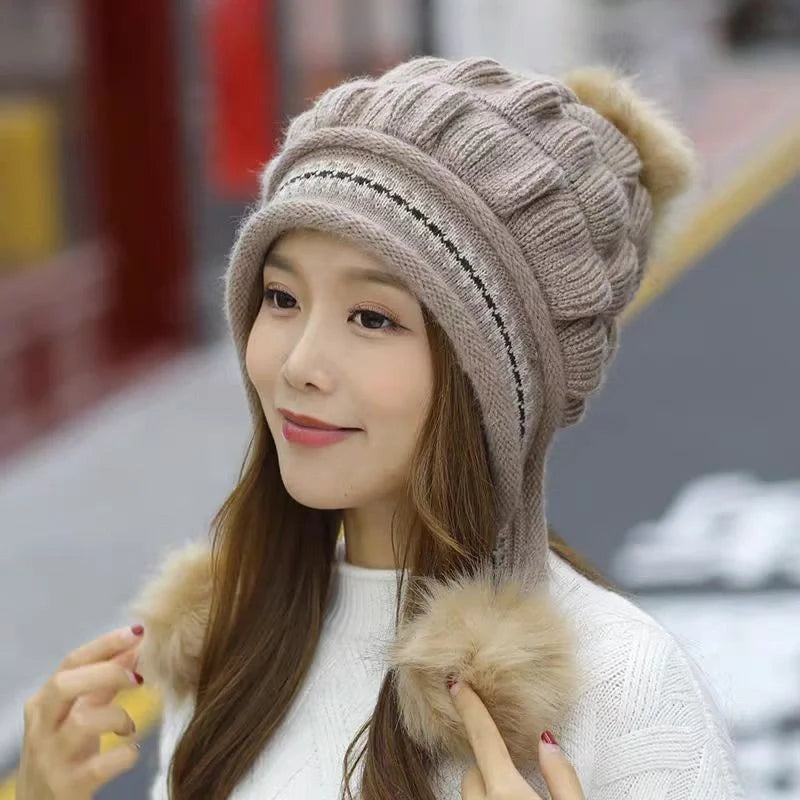Knit fleece beanie with ear flaps and pompom in various colours for winter warmth