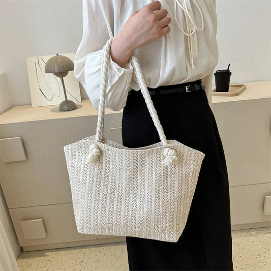 Stylish women's straw shoulder tote bag with large capacity, perfect for summer and everyday use.