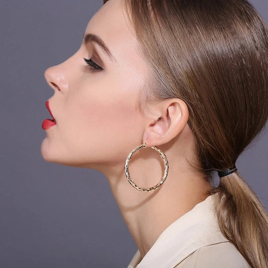 Elegant gold-plated minimalist circular earrings with a sophisticated British design