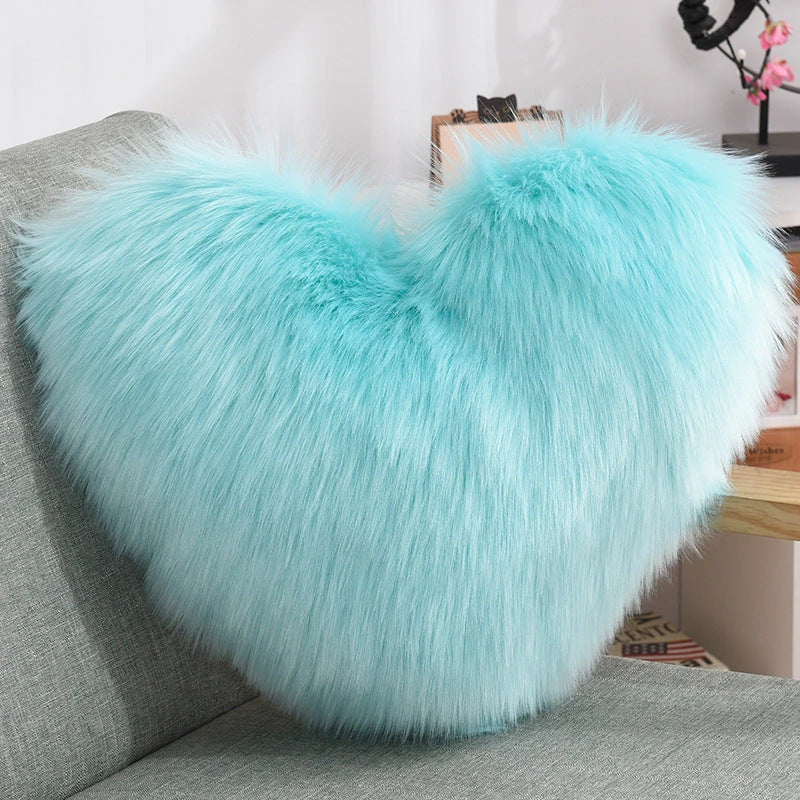 Cozy heart-shaped throw pillow with plush, shaggy texture in various colors