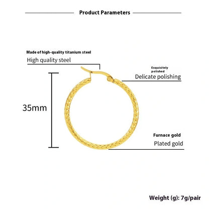 Elegant 18K gold-plated round ring earrings with embossed detail, perfect for any occasion.