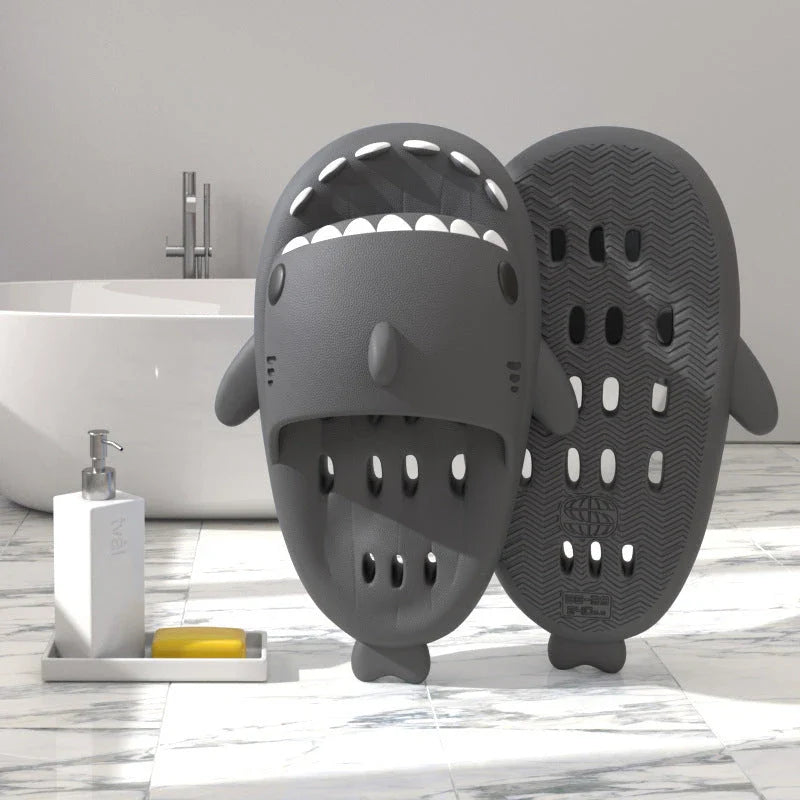 Fashionable shark-themed shower slides with drainage holes, featuring a realistic shark design, quick-drying EVA material, and non-slip traction.