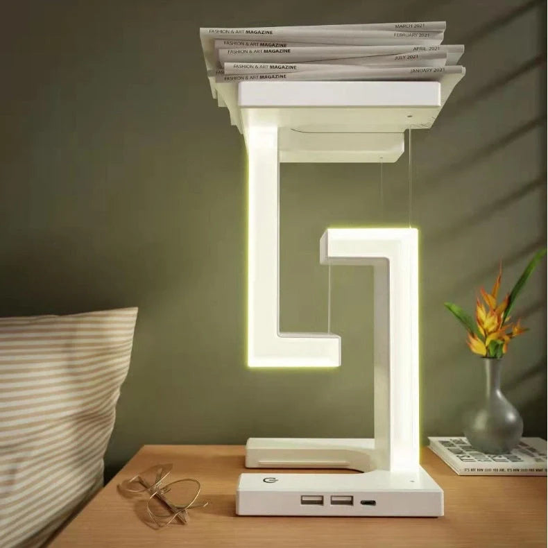 Floating table lamp with wireless charging for smartphones in modern minimalist design