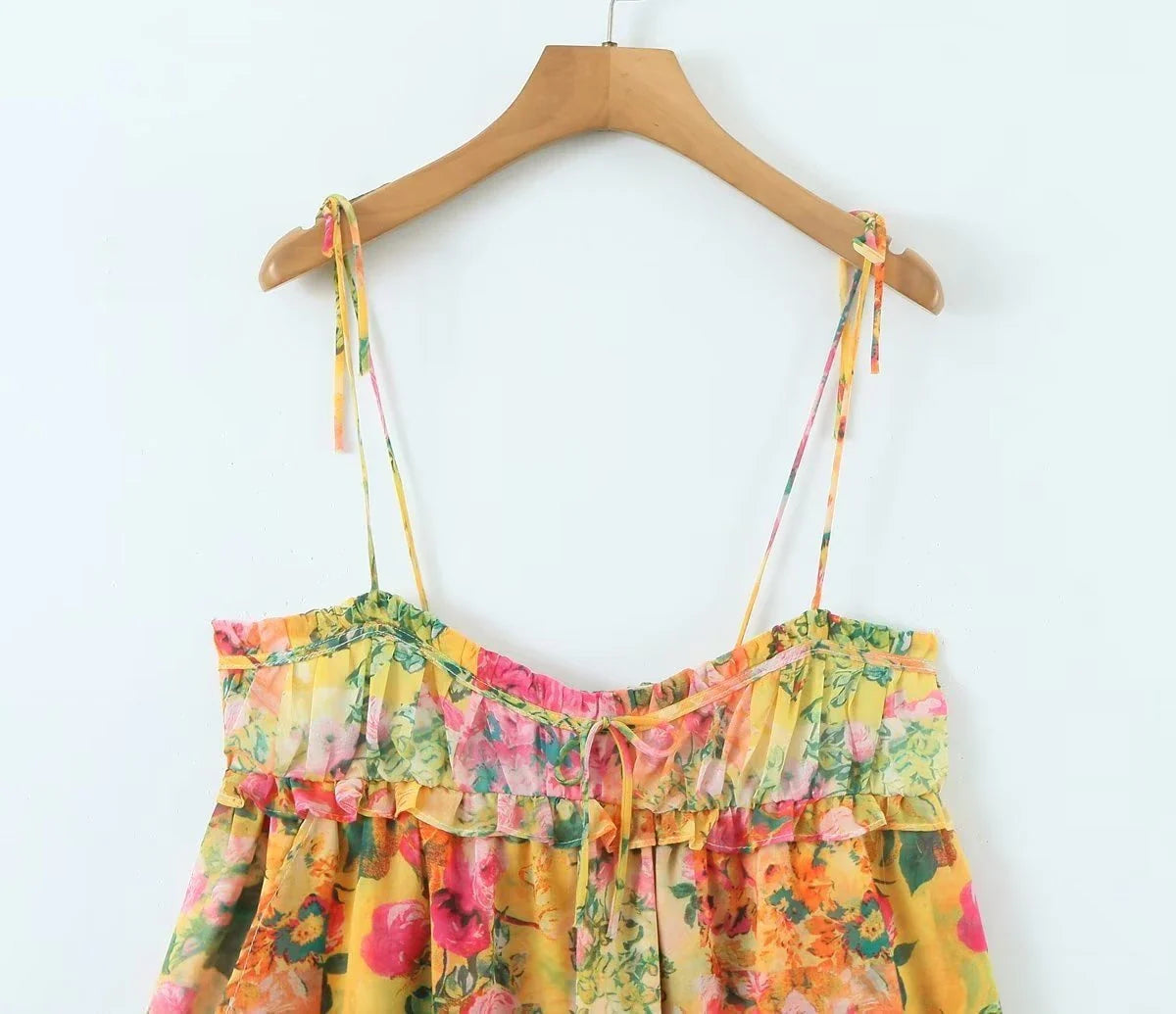 Elegant floral sundress in a variety of colors, featuring an A-line silhouette and ruffled detailing for a stylish and feminine look
