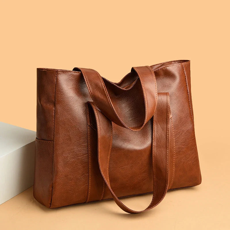 Stylish large capacity commuter shoulder bag in brown and black for autumn and winter
