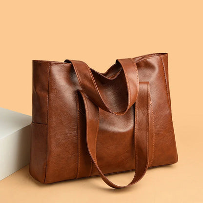 Stylish large capacity commuter shoulder bag in brown and black for autumn and winter