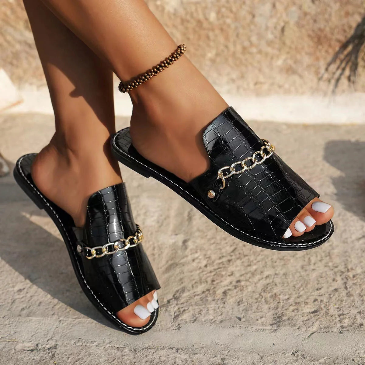 Stylish chain-embellished summer sandals for women featuring a comfortable artificial PU upper and durable rubber soles in a variety of chic colours