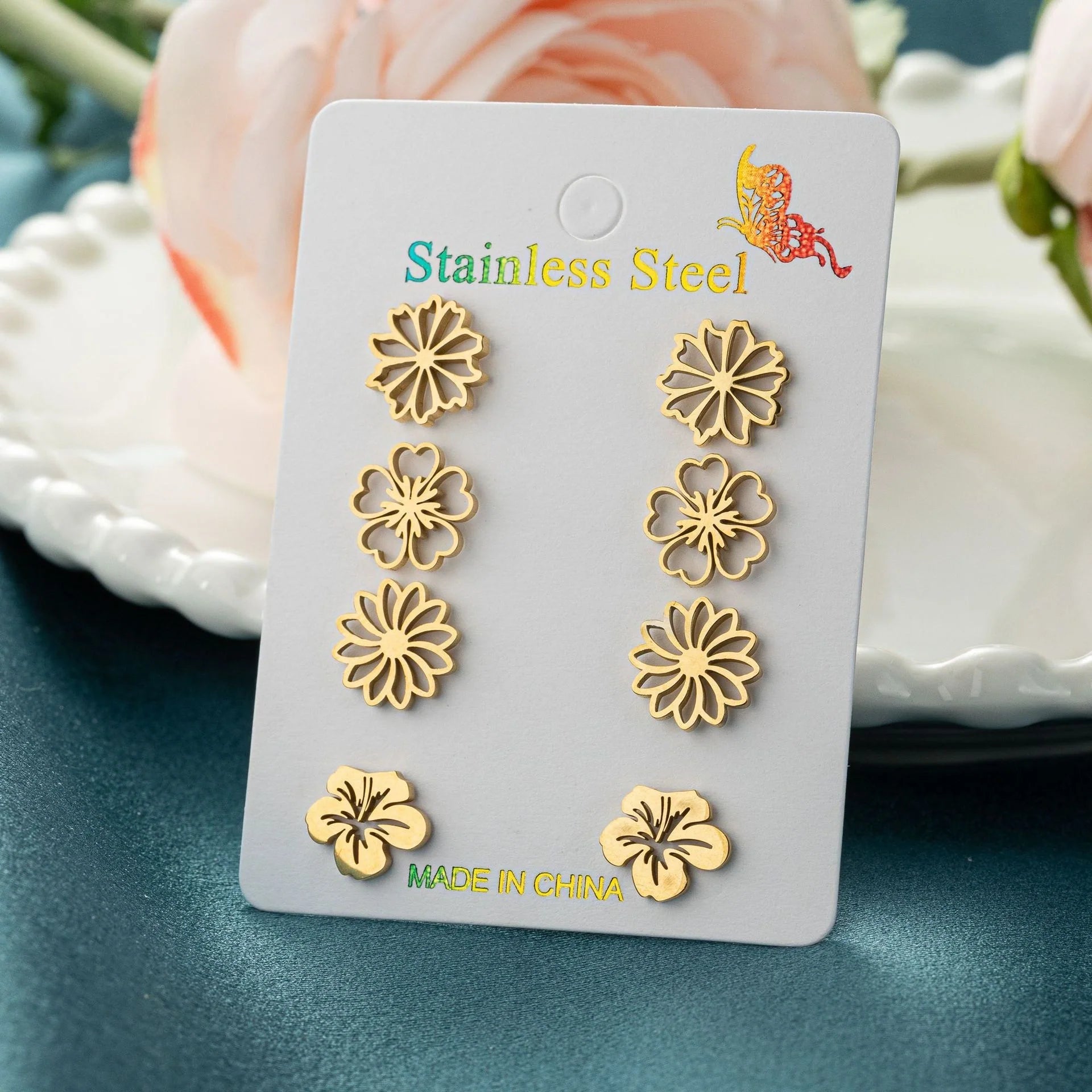 Fashion simulation stud earrings in gold, steel, rose gold, and black
