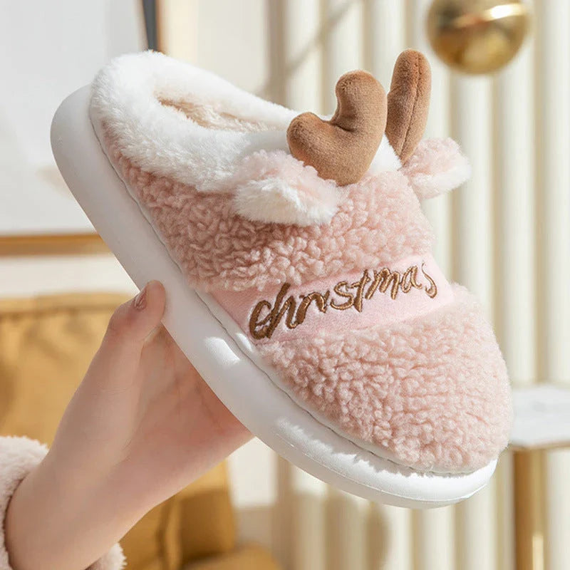 Cozy elk-themed slippers in a variety of festive colors, featuring a plush suede upper and supportive EVA sole for maximum comfort and warmth.